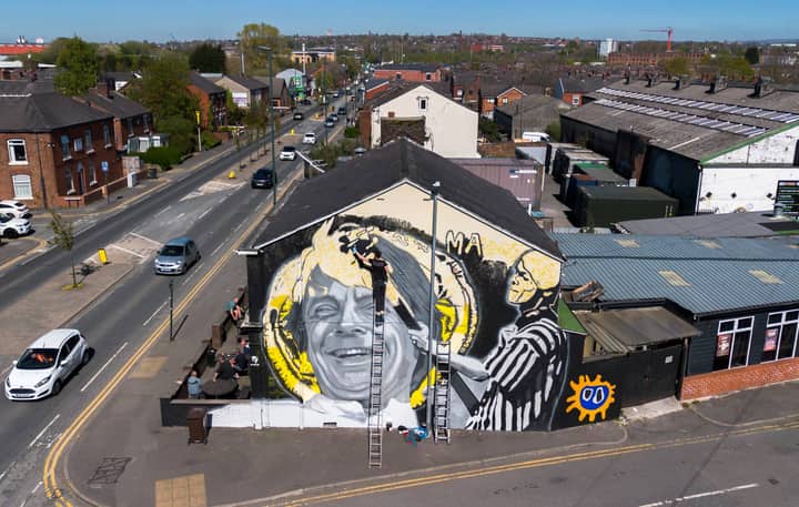 Mural to The Stone Roses icon Mani unveiled in Manchester: “He was, and always will be, adored”