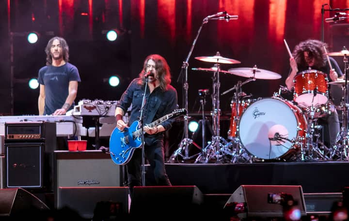 Watch Foo Fighters endure spicy wings and reveal “cringiest lyrics” on ‘Hot Ones Versus’